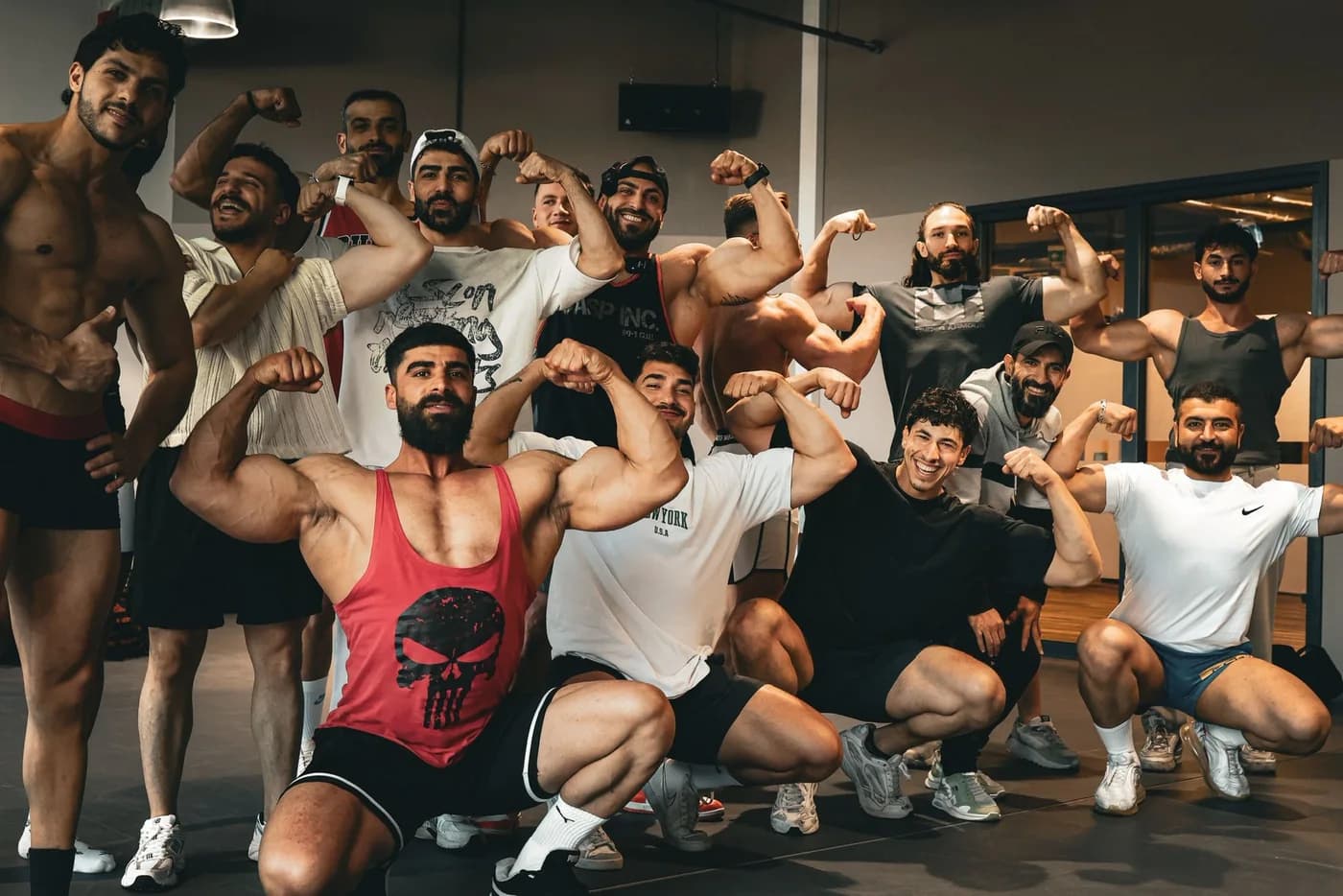 Coach Hassan Ibrahim with his team of athletes at the gym